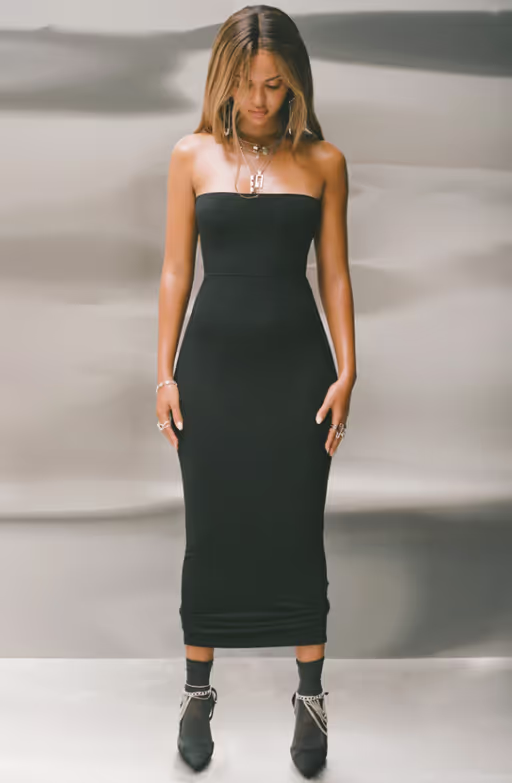 A woman wearing Joah Brown​ black foldover maxi skirt