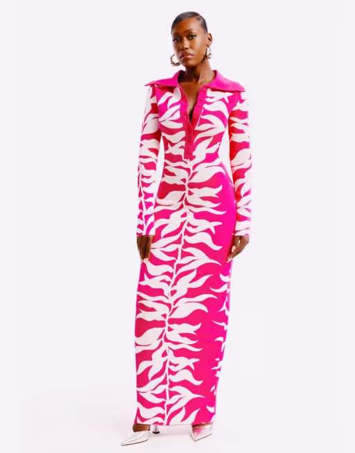 A woman wearing Hanifa fuchsia and white soraya maxi