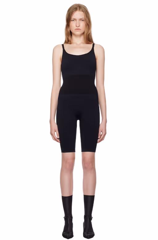 A woman wearing Swedish Stockings black rita jumpsuit