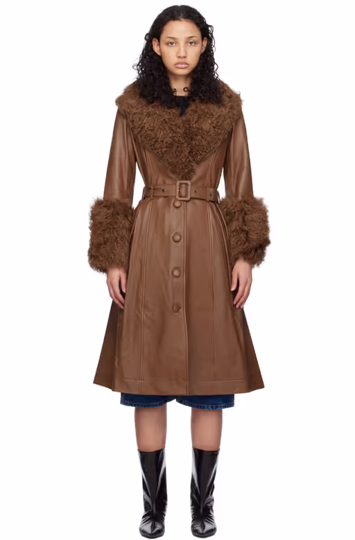 A woman wearing Saks Potts brown foxy shearling coat