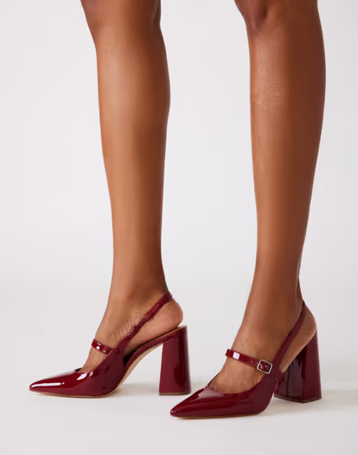 A woman wearing Steve Madden​ maegan wine patent slingbacks