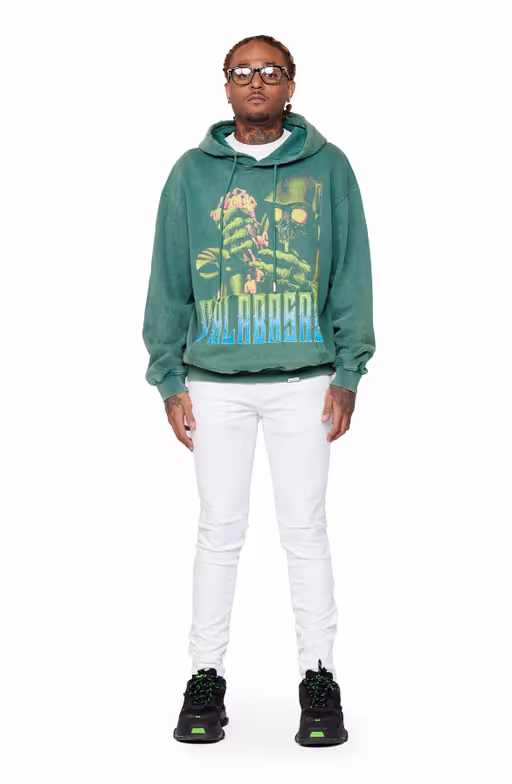 A man wearing Valabasas​ "Green reaper" washed field green hoodie