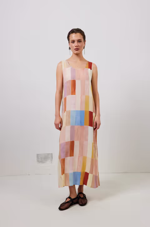 A woman wearing cate smock maxi dress patchwork