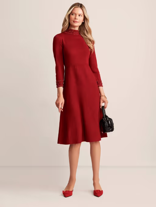 A woman wearing Anne Klein embellished mock neck dress