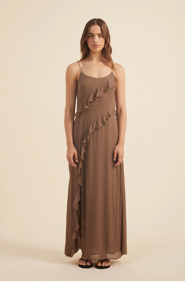 A woman wearing a brown Rove dress