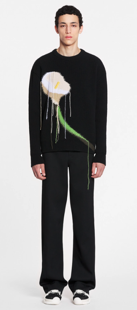 A man wearing a floral Lanvil black sweater and matching pants