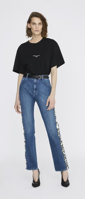A woman wearing a Stella McCartney black boxy t-shirt