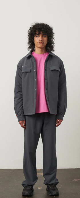 A man wearing a 7 DAYS Active ebony grey tech padded overshirt