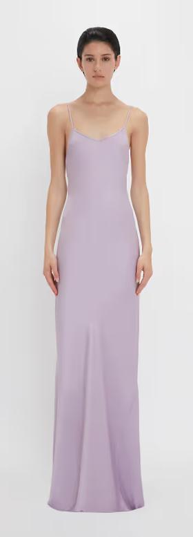 A woman wearing Victoria Beckham purple low back cami floor-length dress in petunia