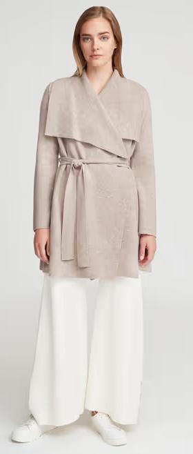A woman wearing Cuyana wool cashmere sweater coat